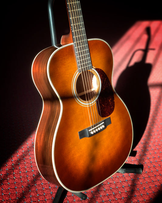 Showroom photo of Martin 000-28 Ambertone Guitar & Case