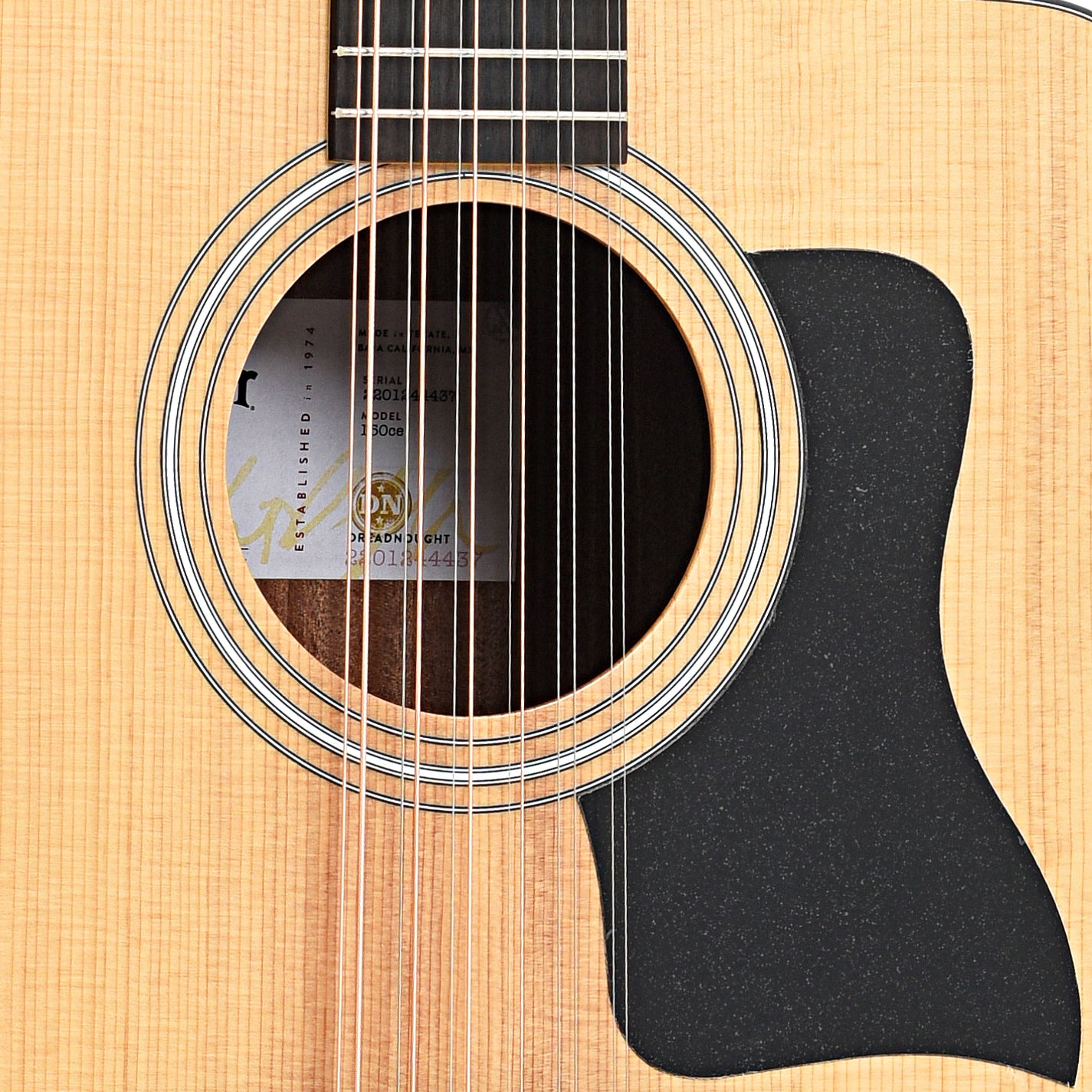 Sound hole and pickguard of Taylor 150ce 12-String Acoustic Guitar 