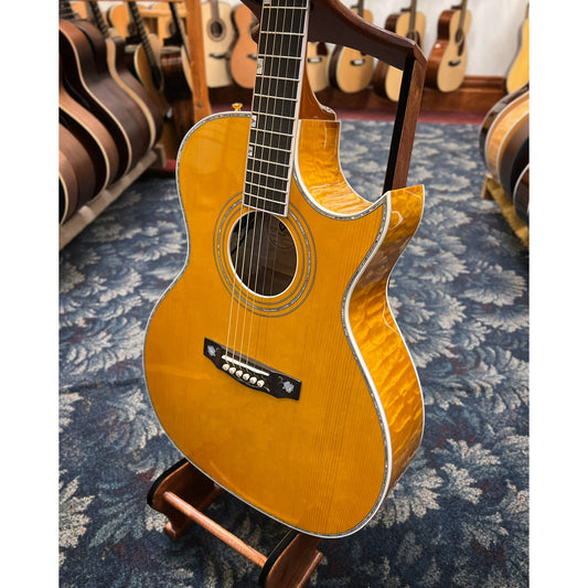 Showroom photo of Guild Doyle Dykes Signature Maple DD-6MC Acoustic-Electric Guitar (c.2013)