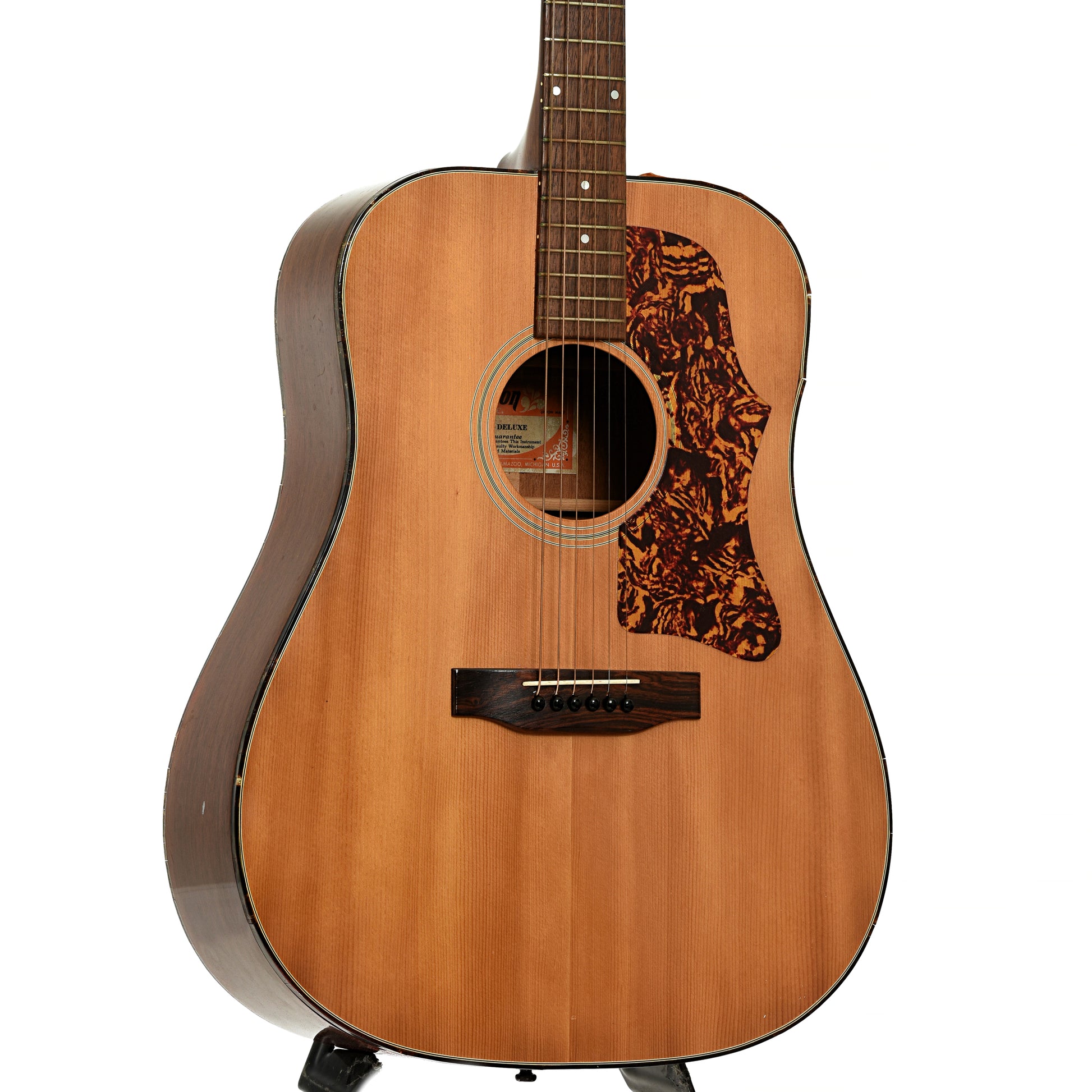 Front and side of Gibson J-50 Deluxe Acoustic Guitar