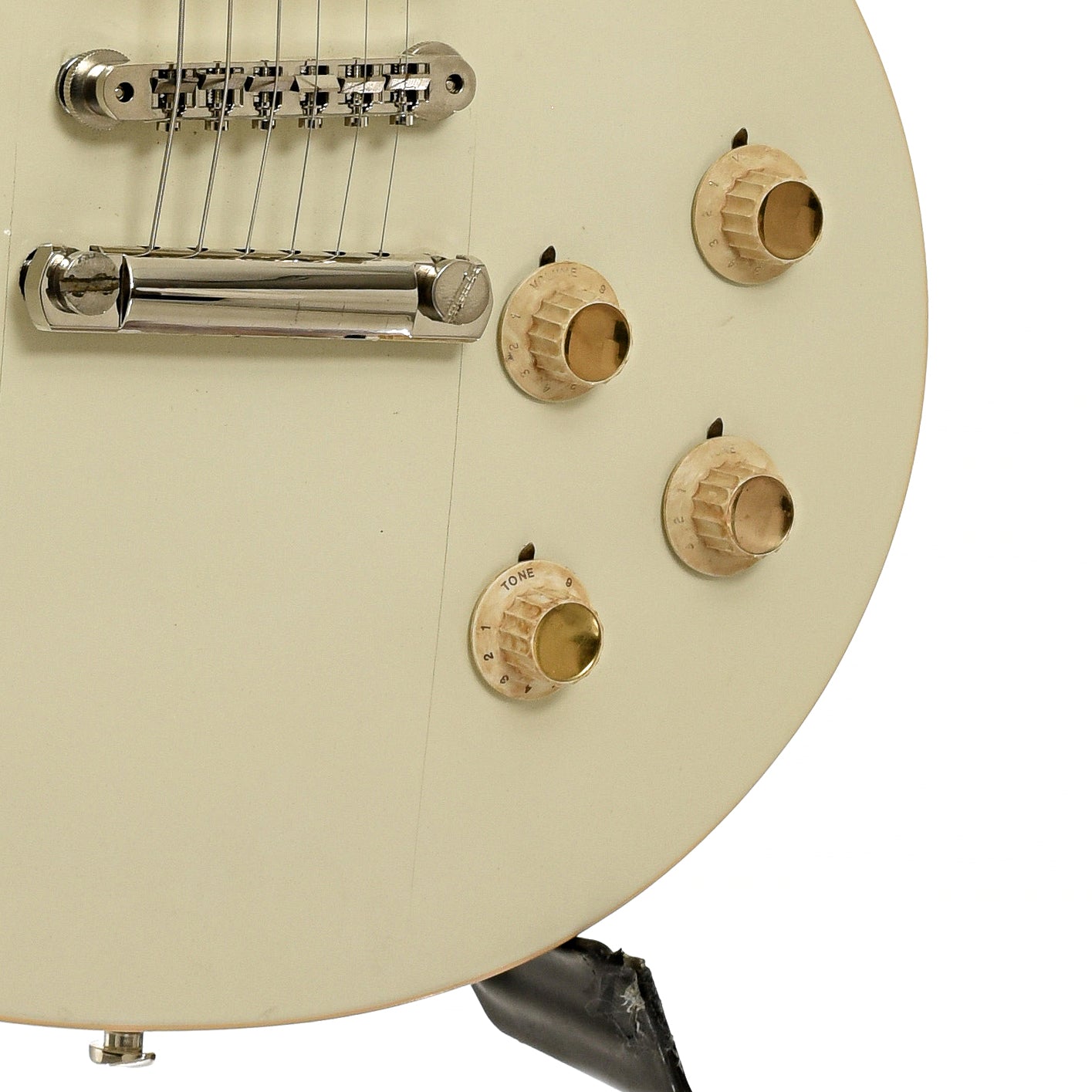 Bridge and controls of Gibson Les Paul Deluxe Electric Guitar