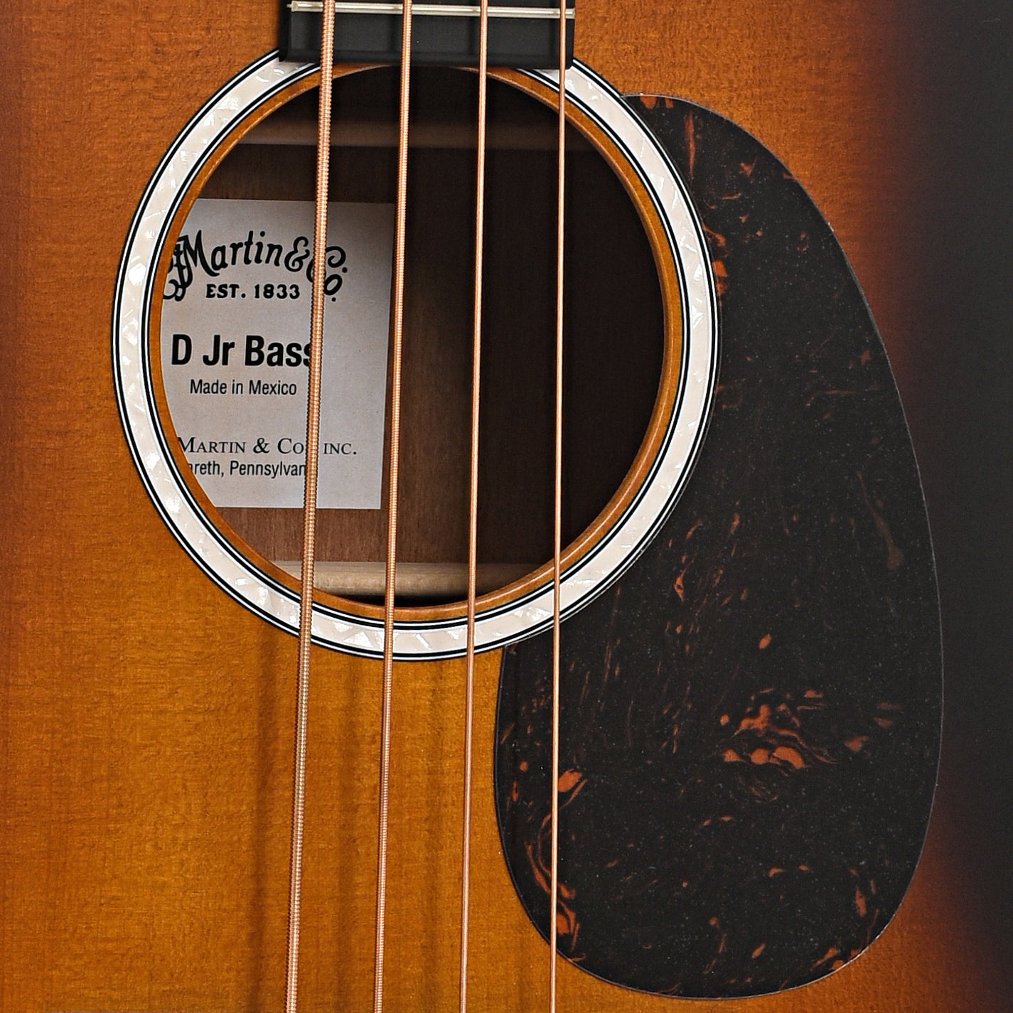 Sound hole and pickguard of Martin DJR-10E Acoustic Bass Guitar