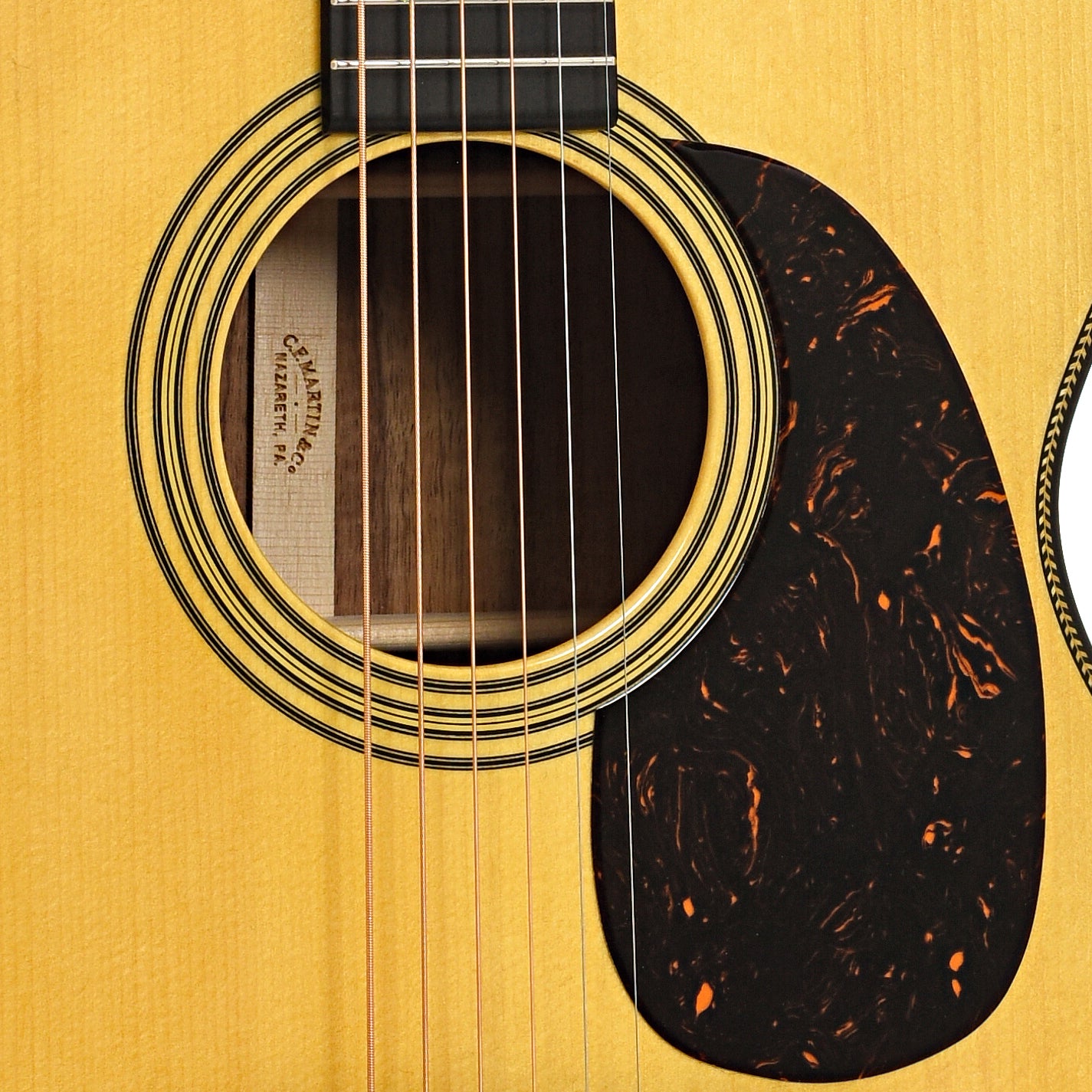 Sound hole and pickguard of Martin Custom 28-Style 000 Guitar