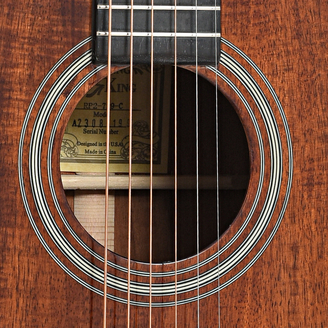 Sound hole of Recording King Tonewood Reserve Koa 00 Cutaway Acoustic Guitar