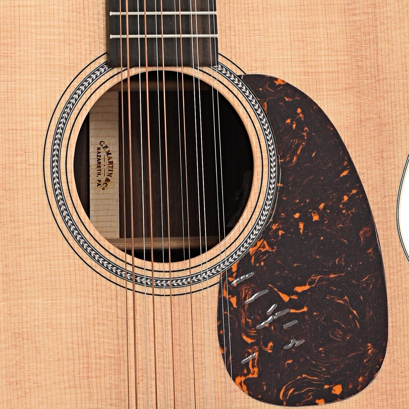 Sound hole and pickguard of Martin Grand J-16E Thin-Body 12-String Guitar