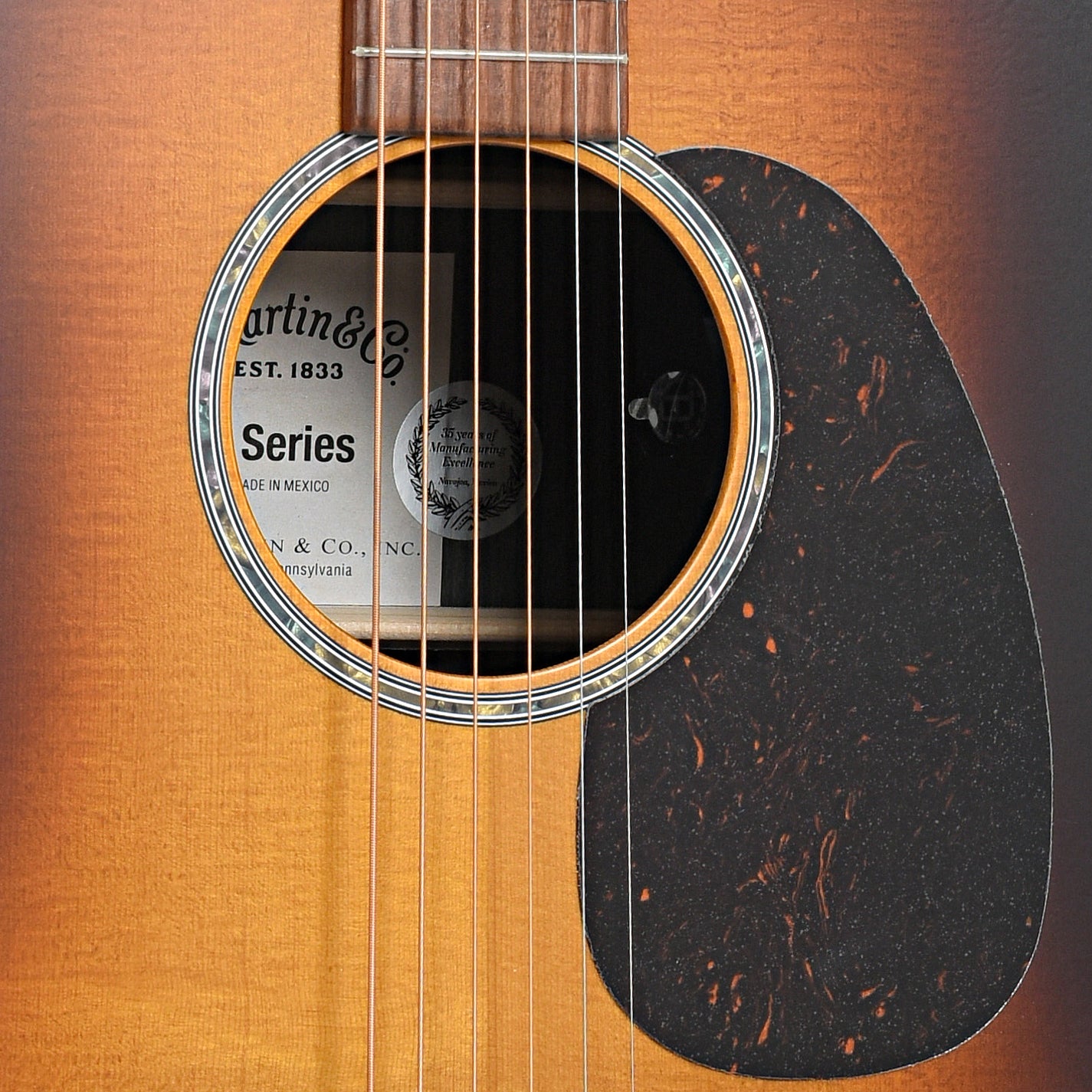 Sound hole and pickguard of Martin D-X2E Ziricote Burst Acoustic Guitar 