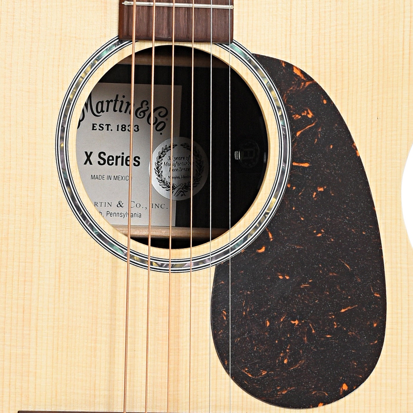 Sound hole of Martin 000-X2E Brazilian Rosewood Acoustic Guitar 