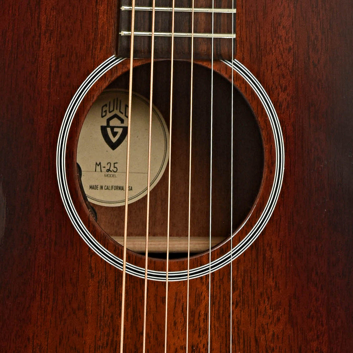 Soundhole of Guild M-25E Acoustic Guitar