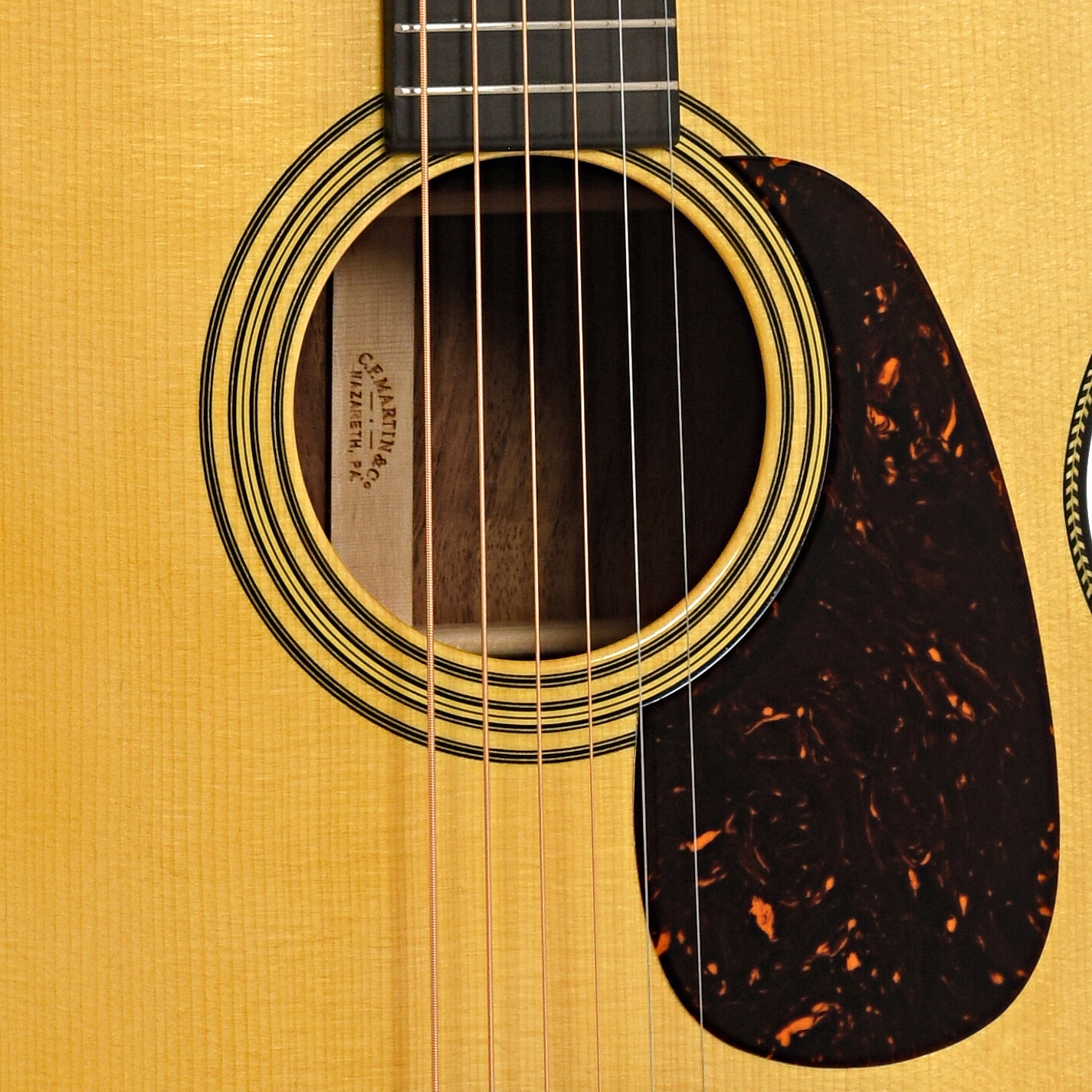 Sound hole and pickguard of Martin Custom 28-Style 14-Fret 00 Guitar