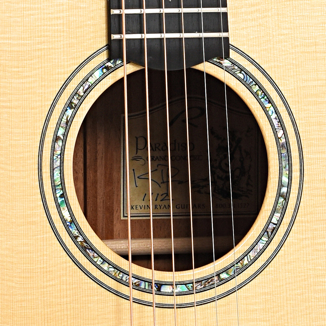 Sound hole of Kevin Ryan Paradiso Grand Concert Acoustic Guitar