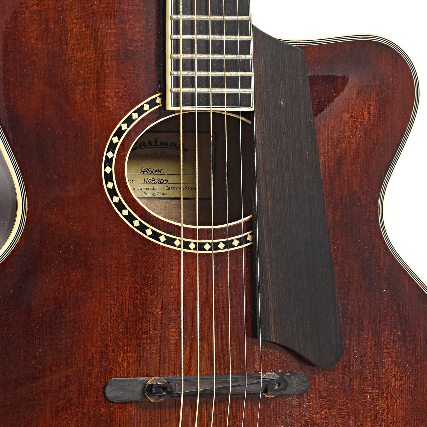 Bridge, sound hole and pickguard of Eastman AR804C Archtop Acoustic Guitar