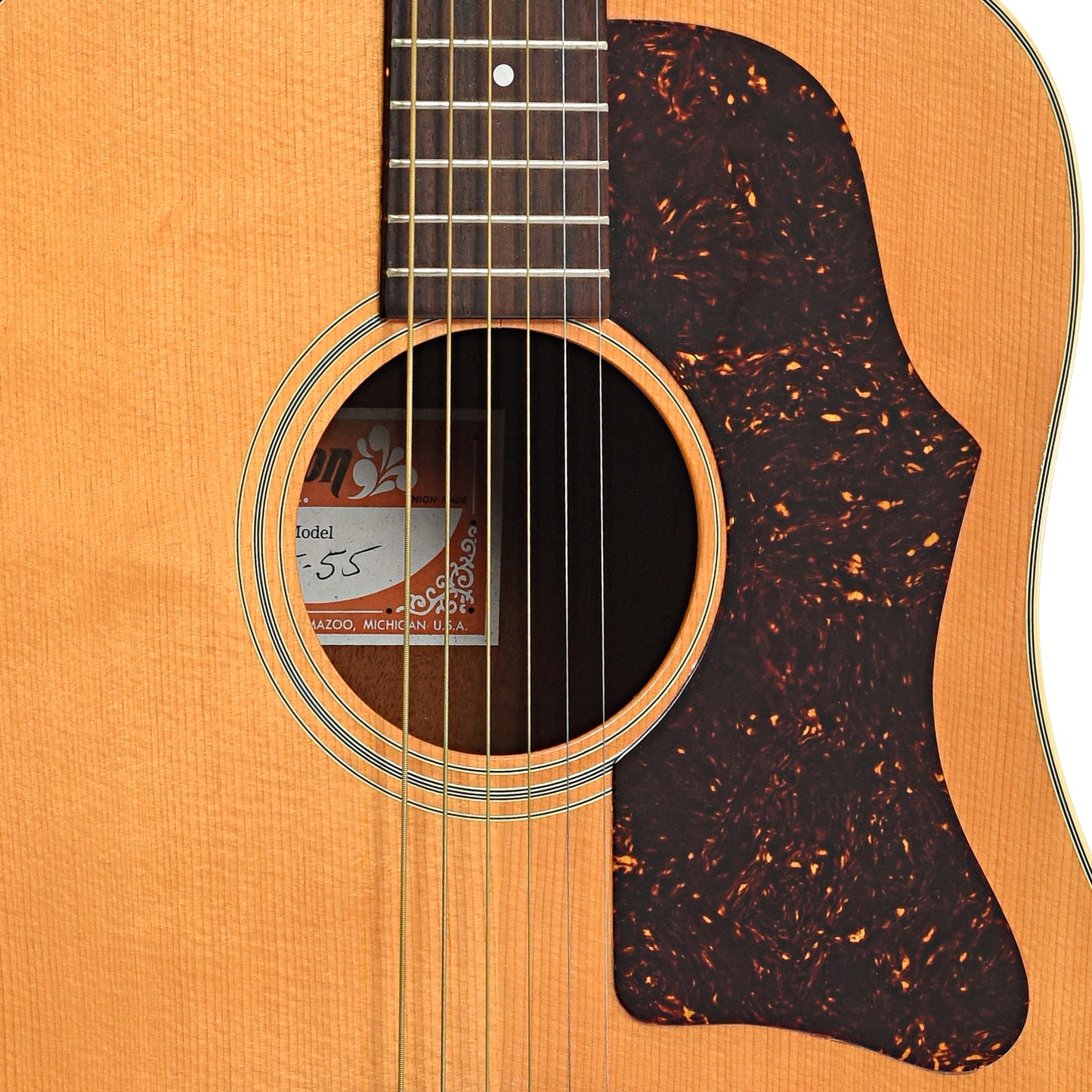 Sound hole and pickguard of Gibson J-55 Acoustic Guitar