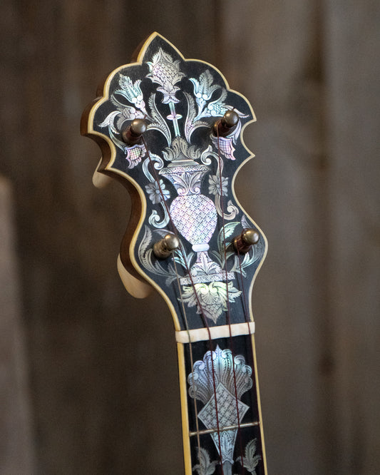 Showroom photo of headstock of Doug Unger Presentation Open Back Banjo (c.2003)