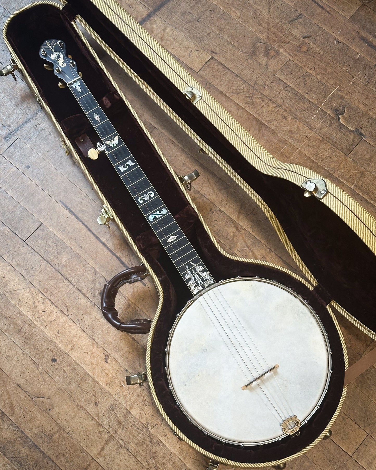 Showroom photo of A. C. Fairbanks Custom Open Back Banjo and Case (1890s)