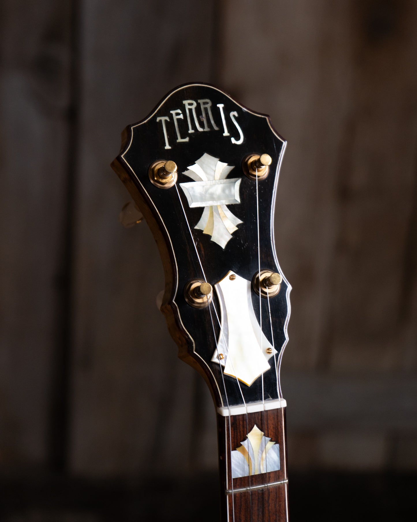 Showroom photo of Headstock of Michael Terris Art Deco Resonator Banjo (2010s)