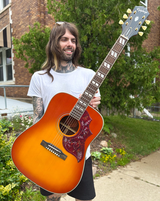 Showroom photo of Epiphone Hummingbird Standard Acoustic Guitar & Gigbag, Cherry Sunburst