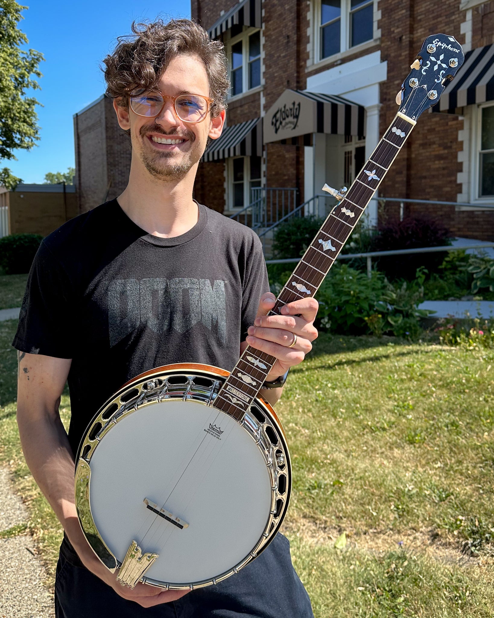 Showroom photo of Epiphone Mastertone Classic Resonator Banjo & Case