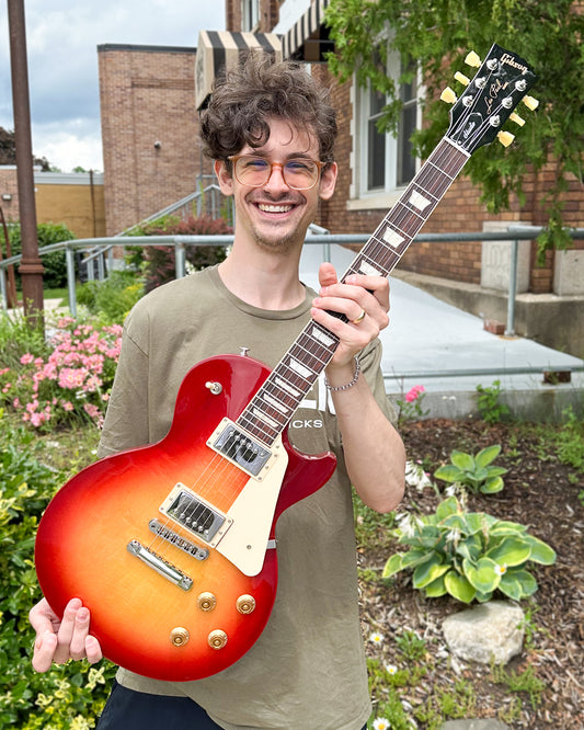 Showroom photo of Gibson Les Paul Studio Electric Guitar & Gigbag, Cherry Sunburst