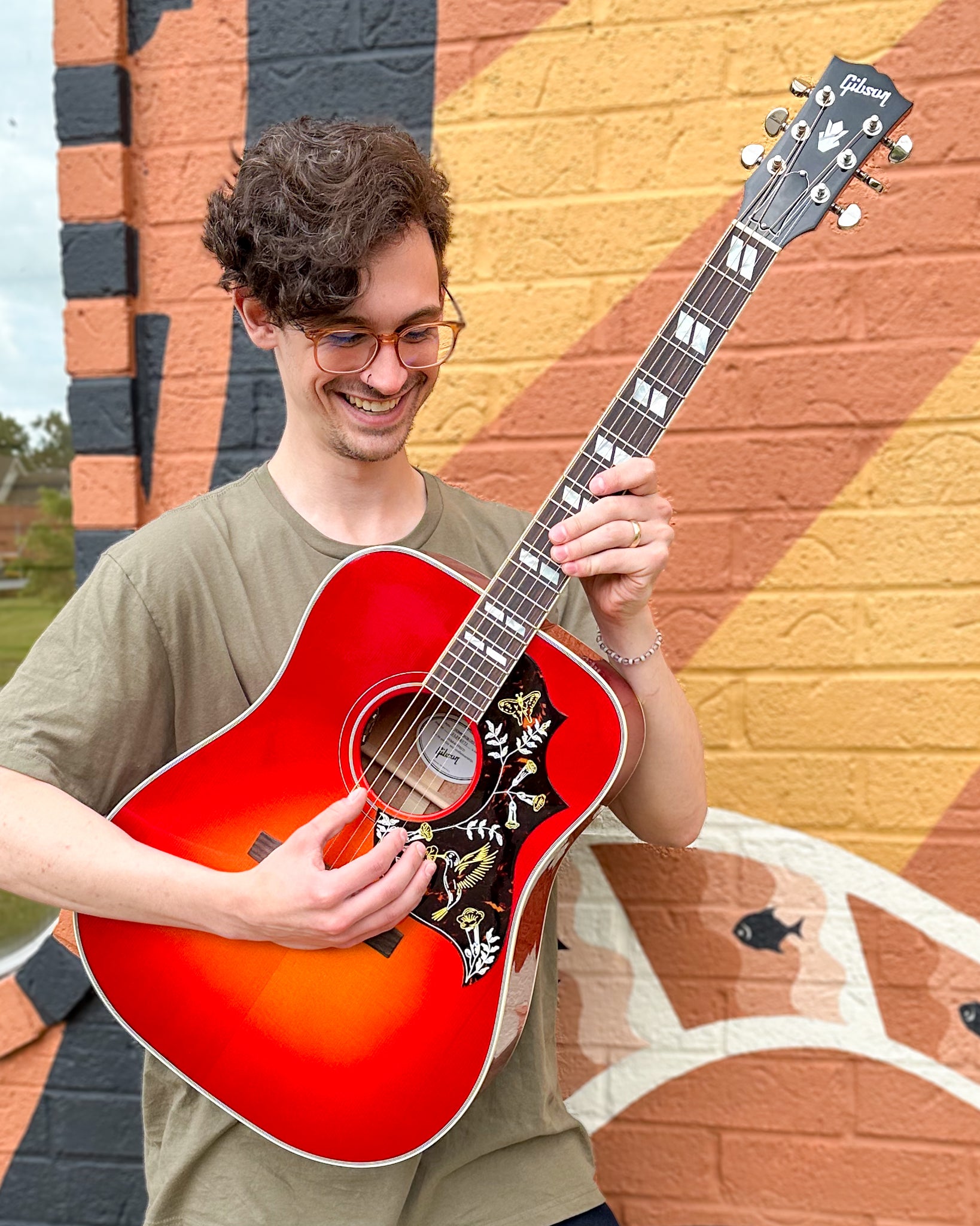 Showroom photo of Gibson Hummingbird Standard Acoustic Guitar & Case, Vintage Cherry Sunburst (VTC Pickup)