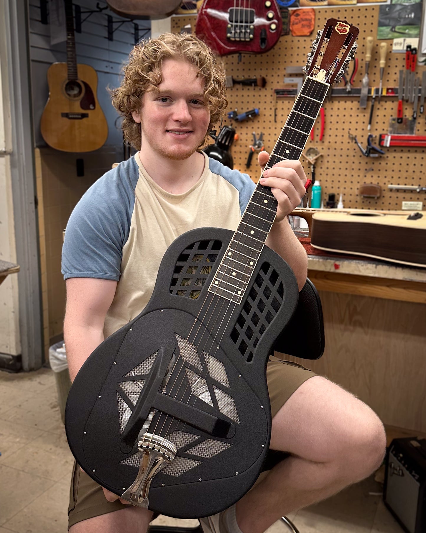 Showroom photo of National K1 Painted Style 1 Tricone Roundneck Resonator Guitar (2003)