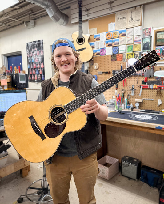 Showroom photo of Santa Cruz Custom OM Acoustic Guitar & Case