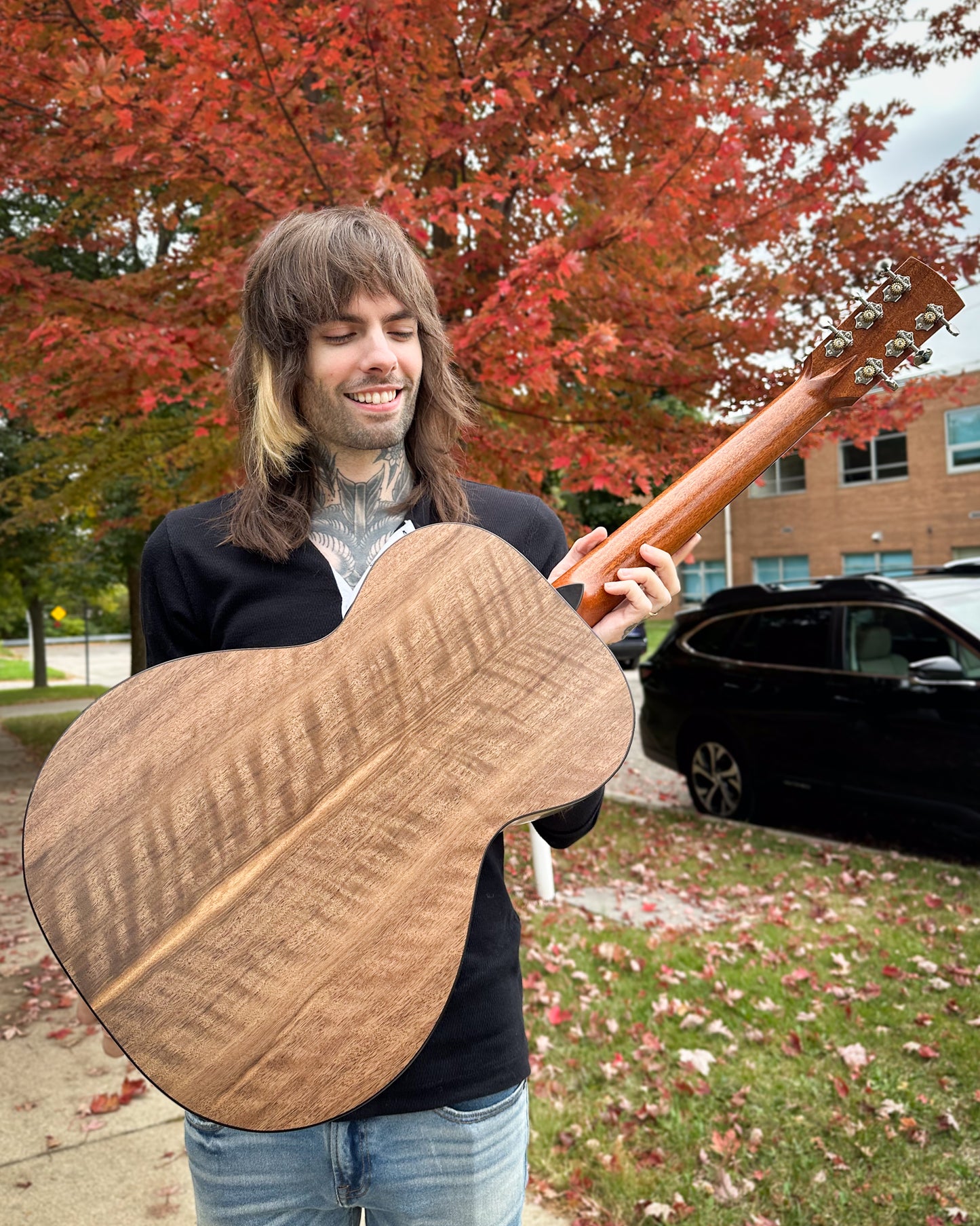 Showroom photo of back of  Cirrus Single 0 Walnut Acoustic Guitar & Case