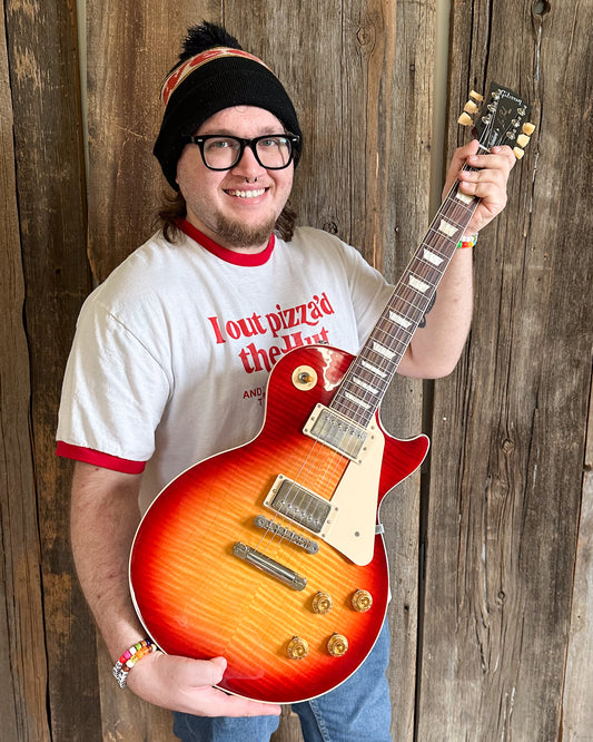 Showroom photo of Gibson Les Paul Standard 50s Figured Electric Guitar & Case, Heritage Cherry Sunburst