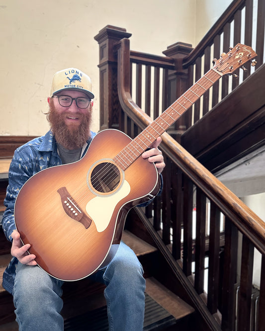 Showroom photo of Taylor Ben Harper Gold Label 512e Special Edition Acoustic Guitar & Case