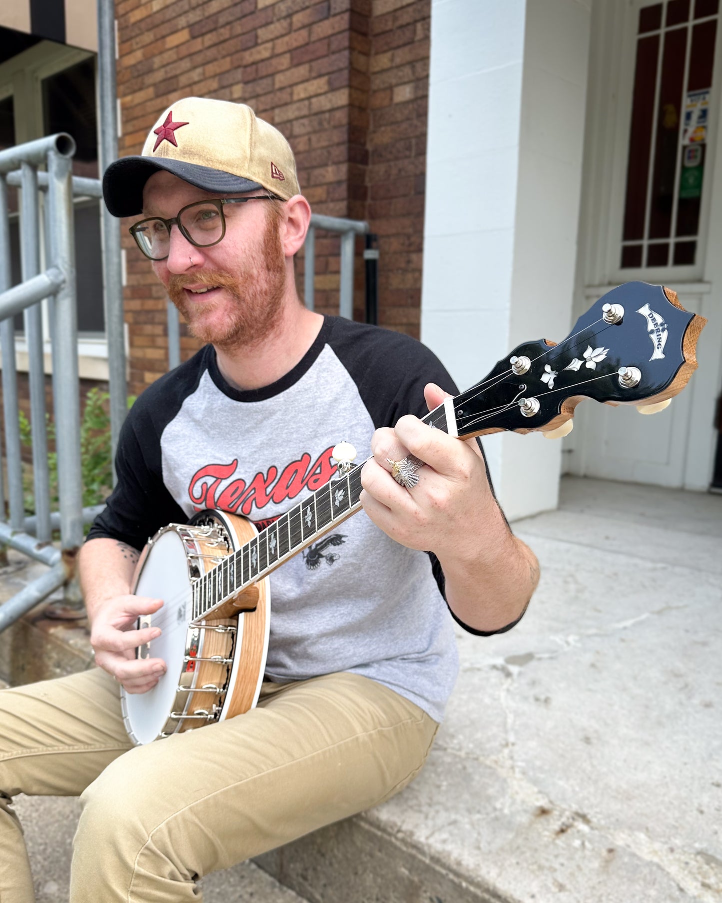 Showroom photo of Deering White Lotus Banjo & Case