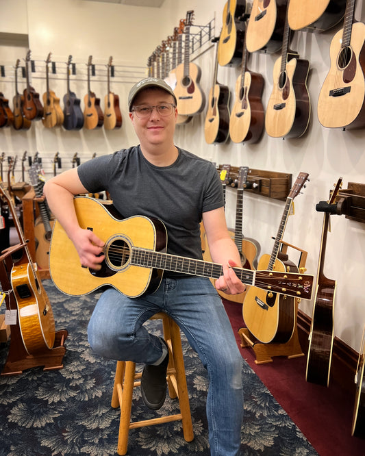 Showroom photo of Martin OM-42 Guitar & Case