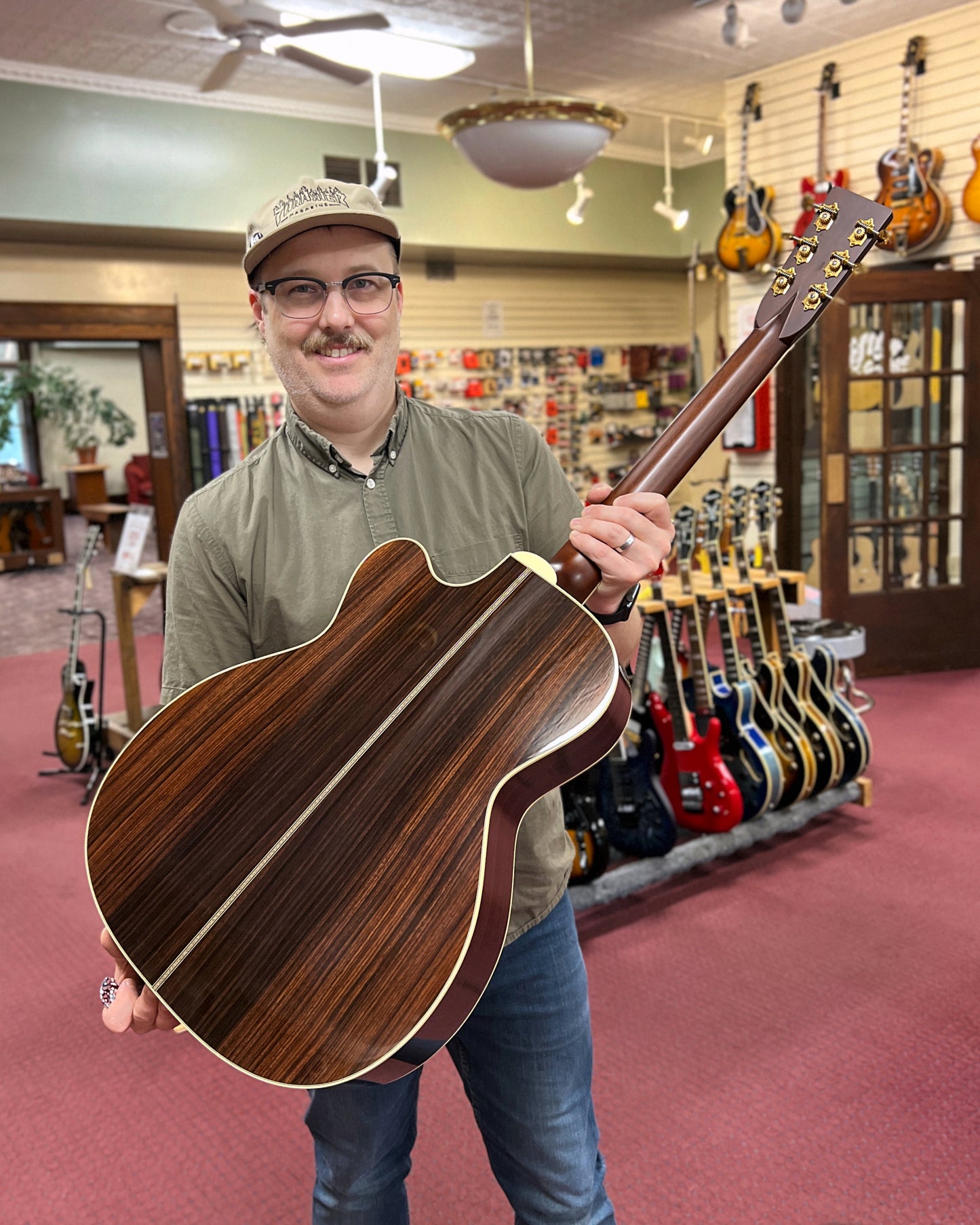 Showroom photo of full Front of Santa Cruz OM Custom Cutaway