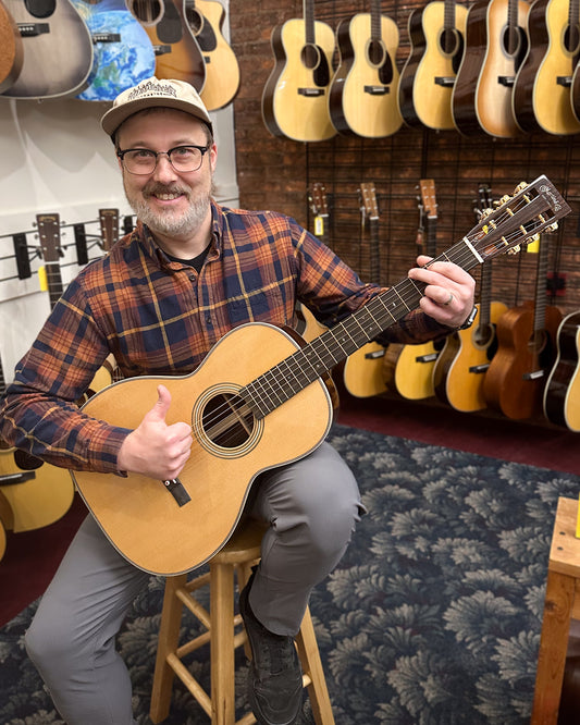 Showroom photo of Martin 00-12 28 Modern Deluxe Guitar & Case