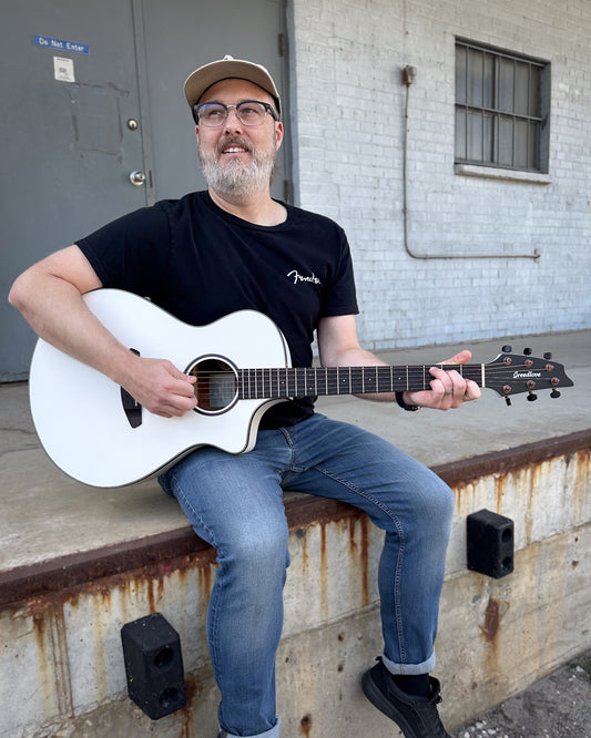 Showroom photo of Breedlove Discovery Concert Satin White CE European-African Mahogany Acoustic-Electric Guitar