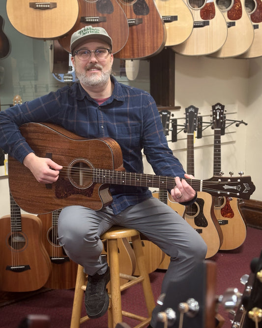 Showroom photo of Guild Westerly Collection D-120CE Cutaway Guitar & Gigbag