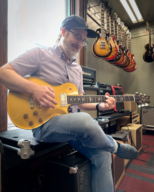 Showroom photo of PRS McCarty 594 Singlecut Gold Metallic Electric Guitar