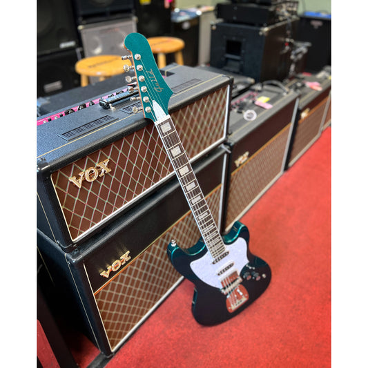 Showroom photo of Guild Surfliner Deluxe Electric Guitar, Evergreen Metallic