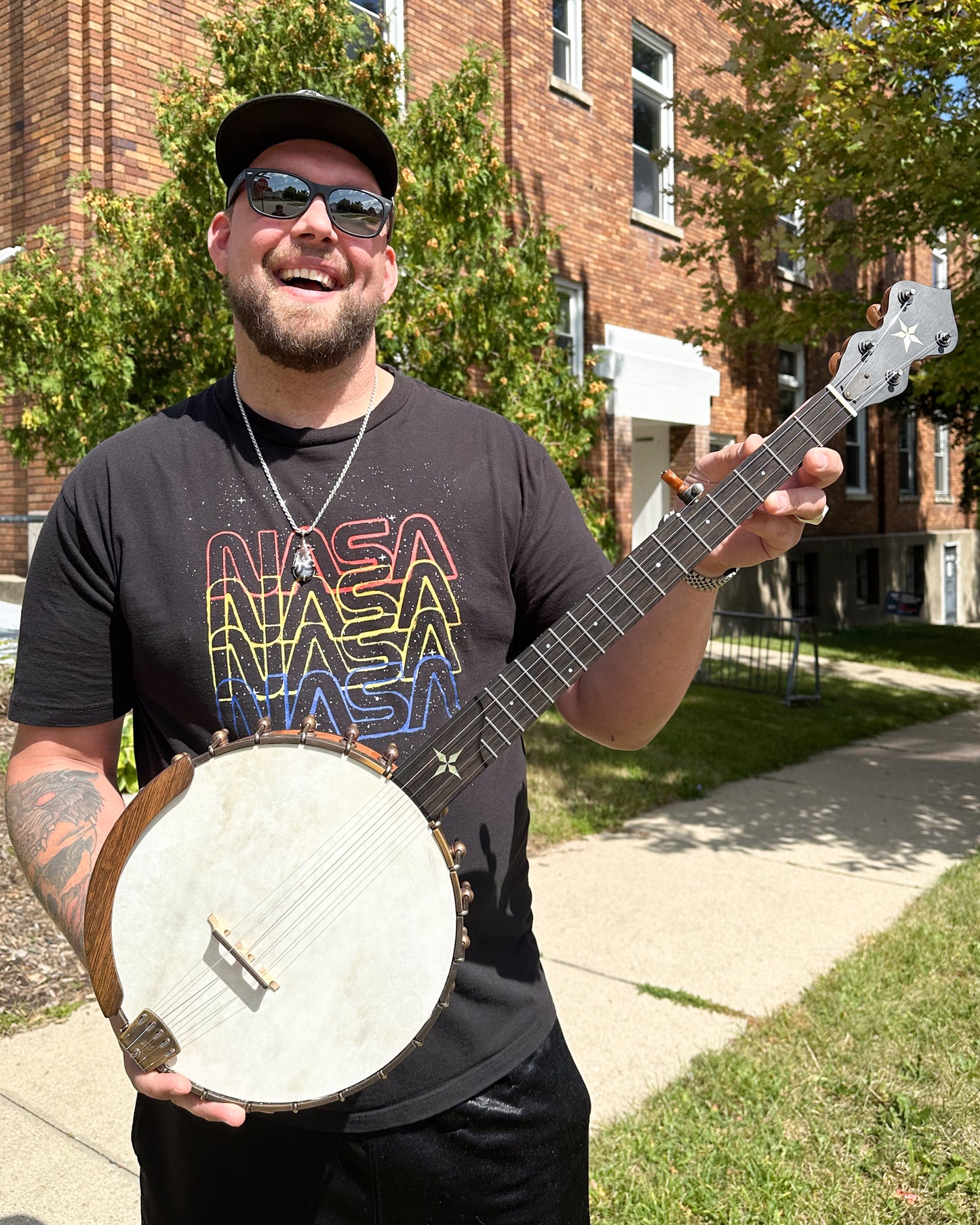 Showroom photo of Ome Wizard Cherry 11" Open Back Banjo (c.2021)
