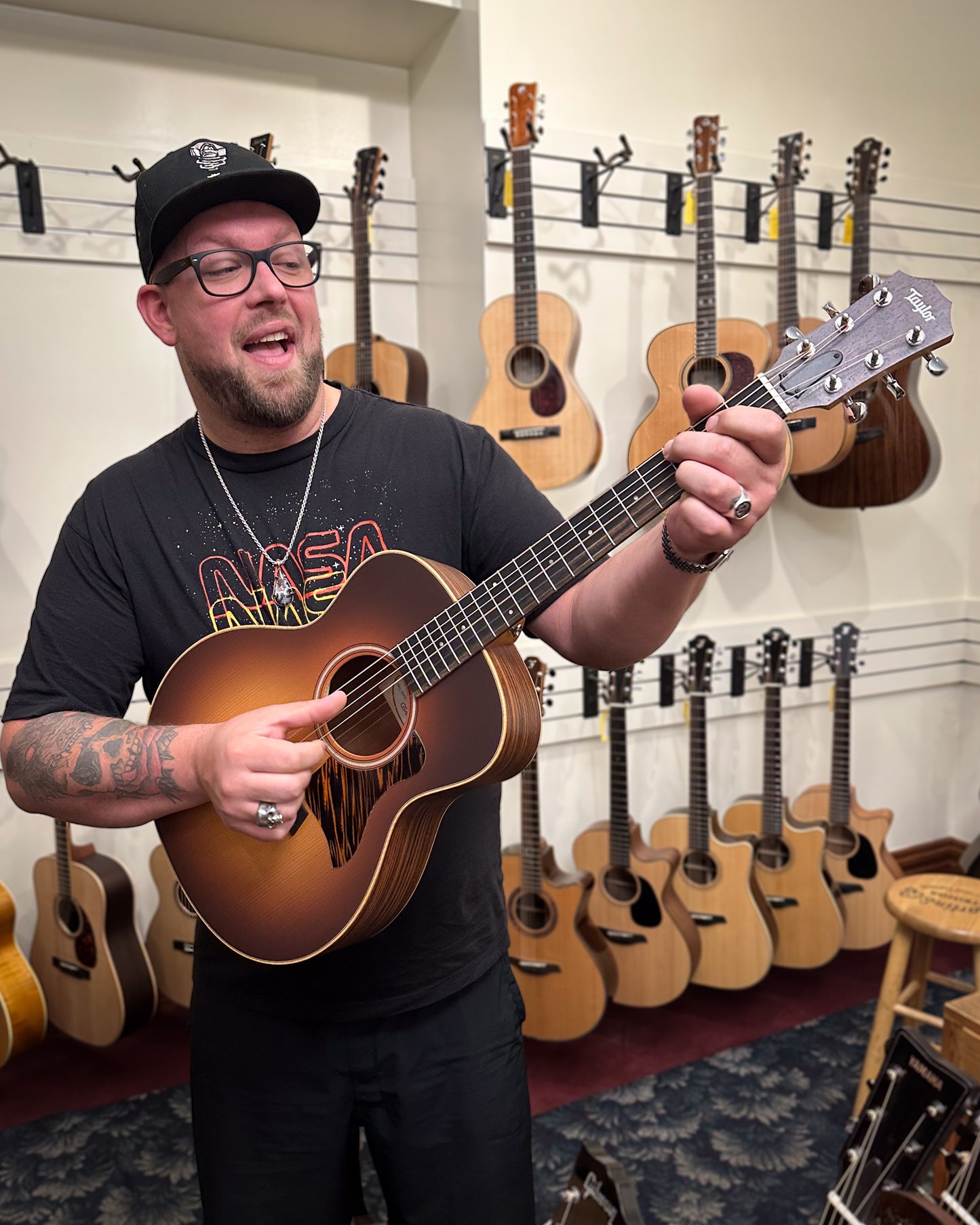 Showroom photo of Taylor GS Mini-e Rosewood Sunburst Acoustic Guitar & Gig Bag