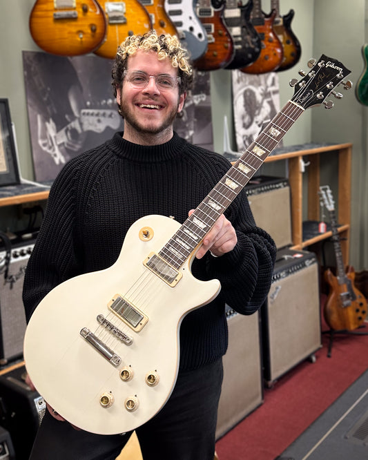 Showroom photo of Gibson Les Paul Deluxe Electric Guitar (1970s)