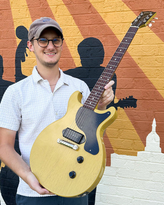 Showroom photo of Gibson Les Paul Junior Double Cut Electric Guitar & Case, TV Yellow