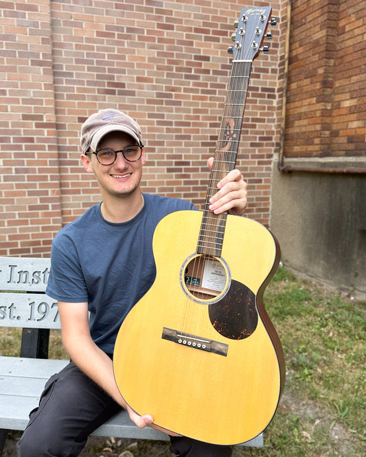 Showroom photo of Martin 000-10E Shawn Mendes Guitar & Case