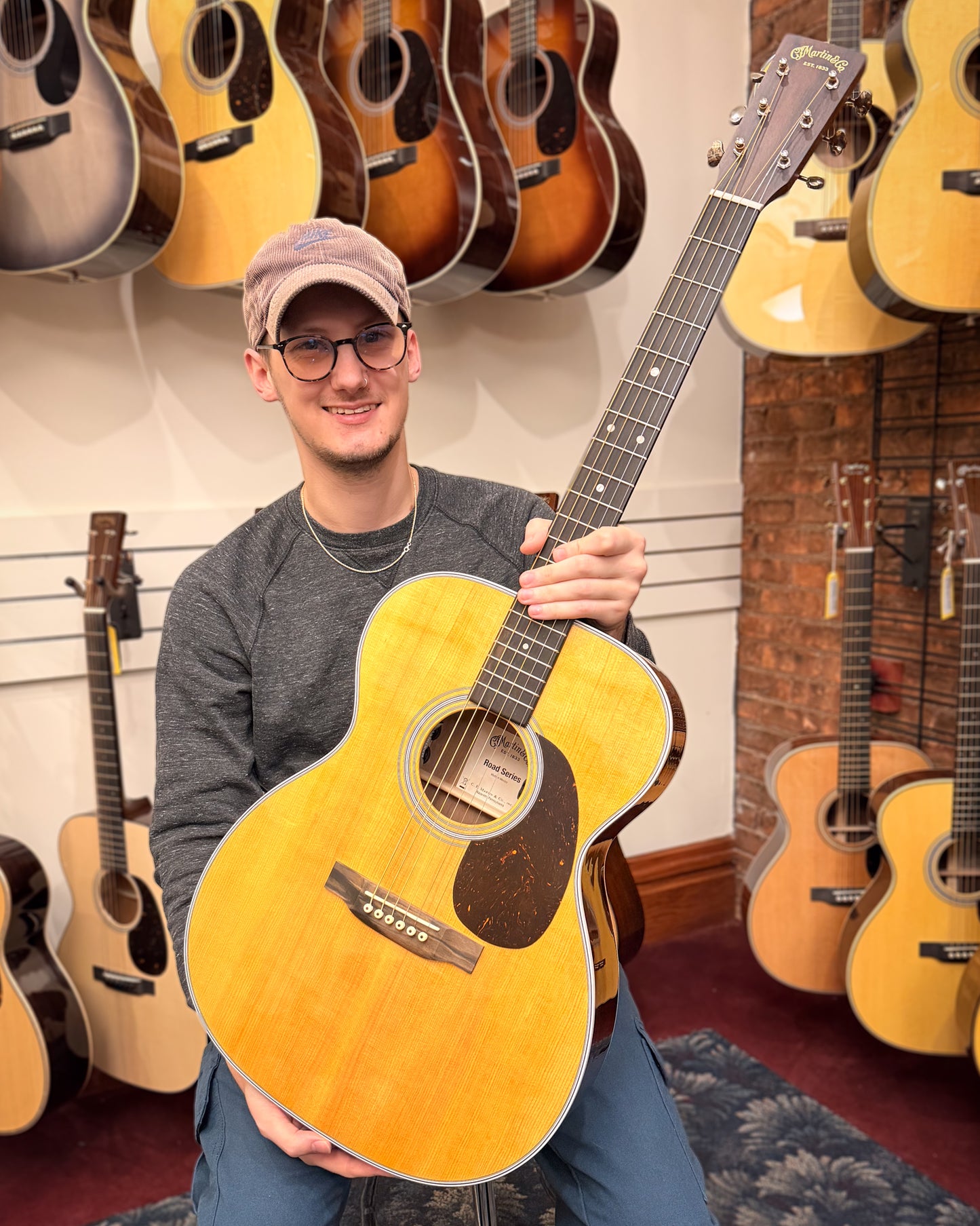 Showroom photo of Martin 000-13E Retro Walnut Guitar & Gigbag