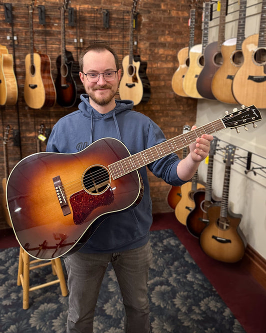 Showroom photo of Bourgeois Aged Tone Series Advanced Slope Shoulder Dreadnought Guitar