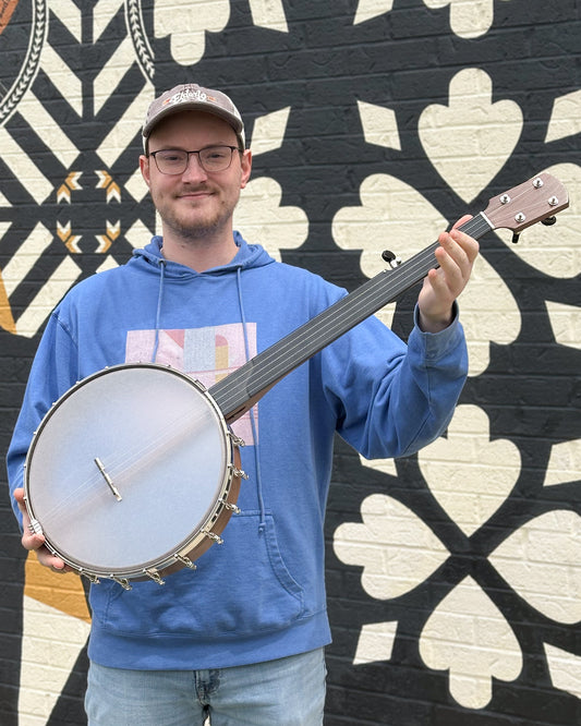 Showroom photo of Kevin Enoch Tradesman Fretless 12in Openback Banjo & Gigbag, Walnut