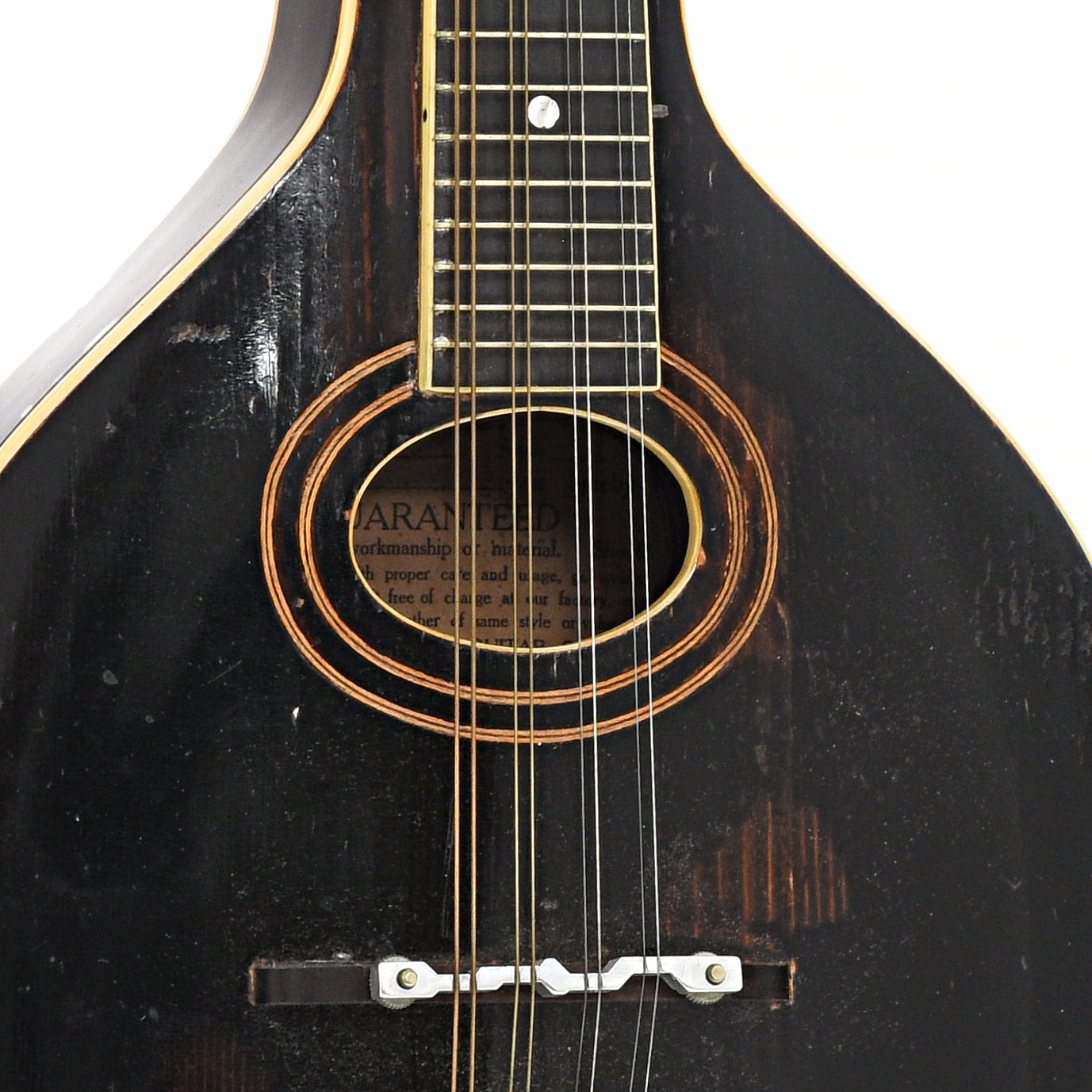 Soundhole and bridge of Gibson A-2 