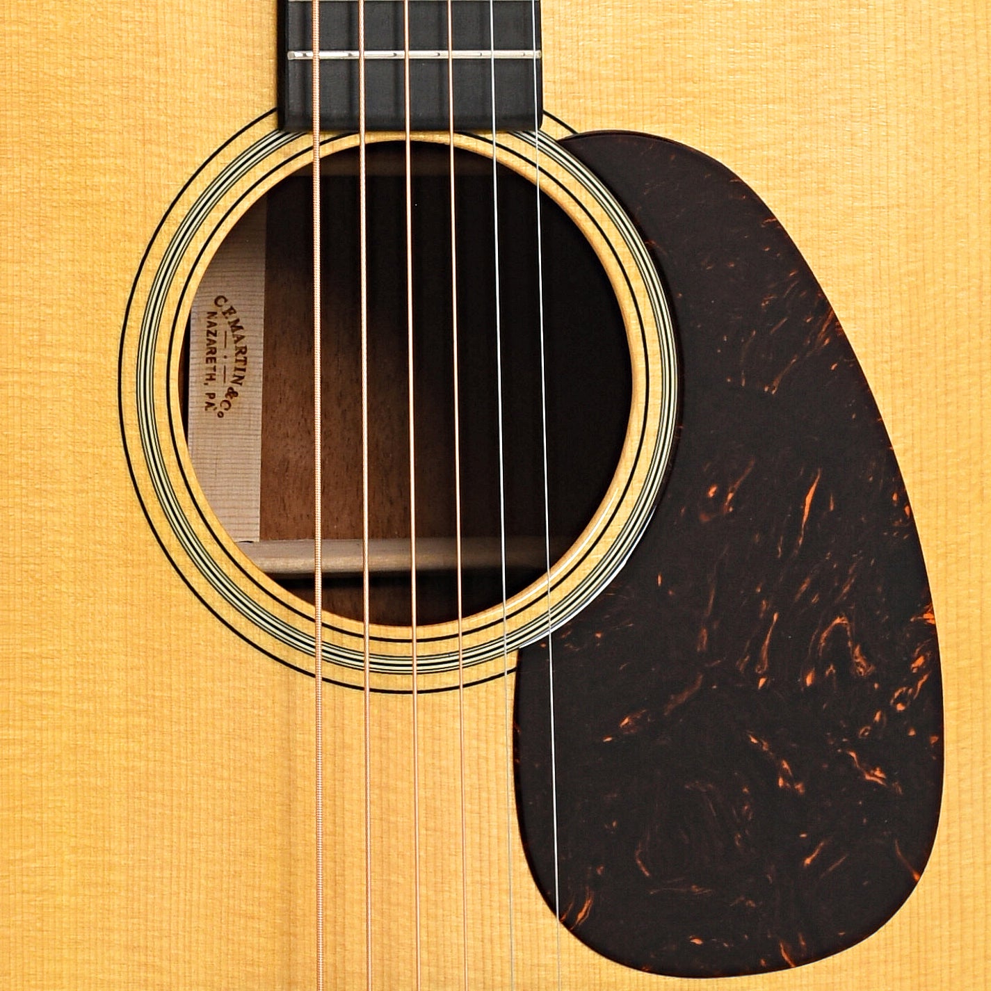 Sound hole and pickguard of Martin Custom 18-Style Dreadnought, Quilted Mahogany