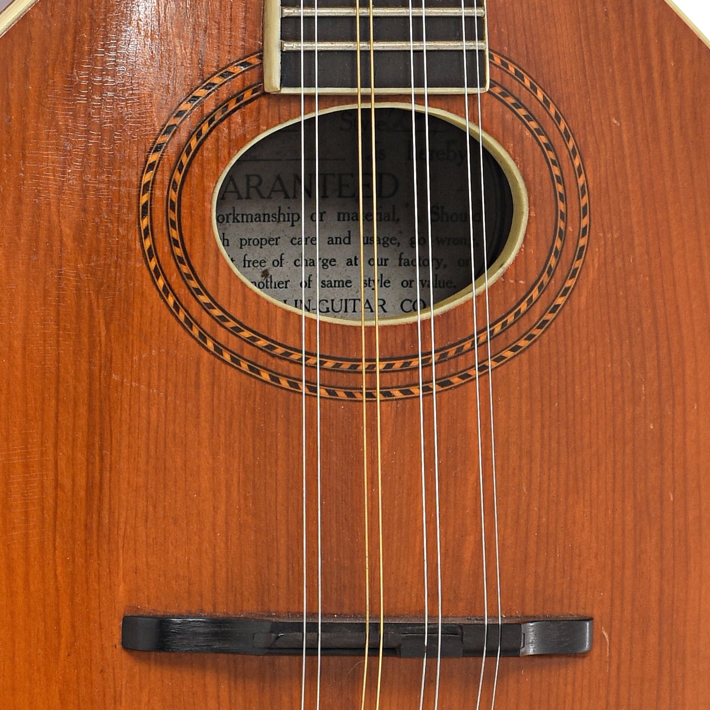 Bridge and sound hole of Gibson A-1 Mandolin