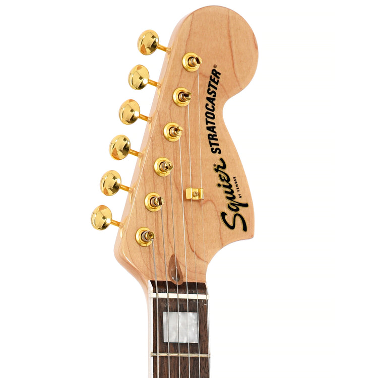 Front headstock of Squier 40th Anniversary Stratocaster, Gold Edition, Lake Placid Blue