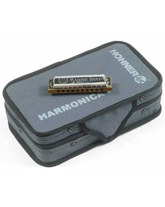 Front of Hohner Case of Marine Bands 5 Pack of Marine Band Harmonica on top of case